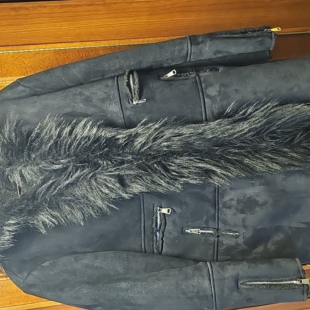 Black women's coat with hood and faux fur trim.